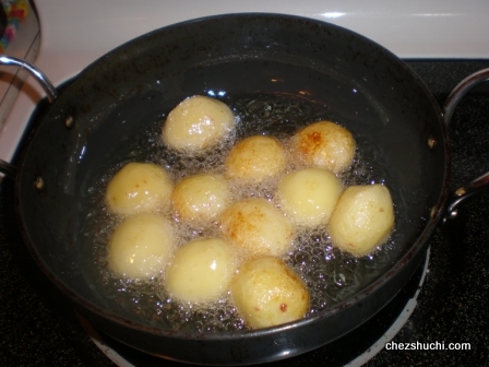 potatoes are being deep fried